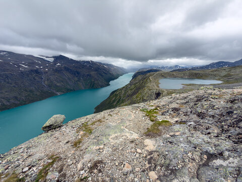 Boulder above two lakes on the Besseggen ridge, Jotunheimen