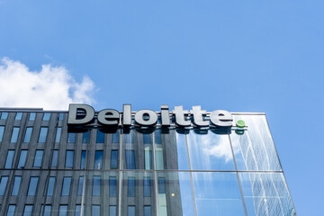 Obraz premium Toronto, Ontario, Canada - September 7, 2026: Closeup of Deloitte sign on the building in Toronto, Ontario, Canada. Deloitte is a British multinational professional services network. 