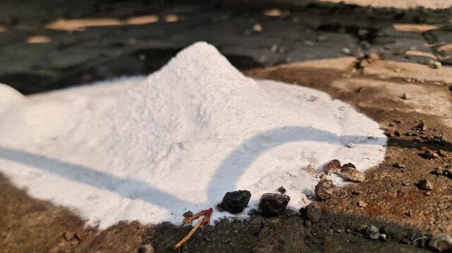 Pile of Solid Carbon Dioxide (Dry Ice) Sublimating on Outdoor Paving Blocks