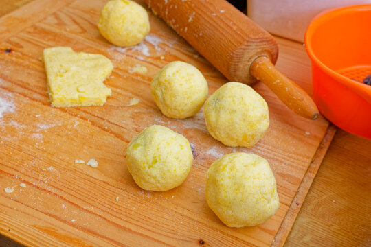 Preparing potato dough plum dumplings