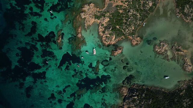 Top Down Aerial View of Sailboat Near an Island in La Maddalena Archipelago, Sardinia