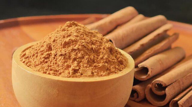 Turmeric powder in a wooden cup