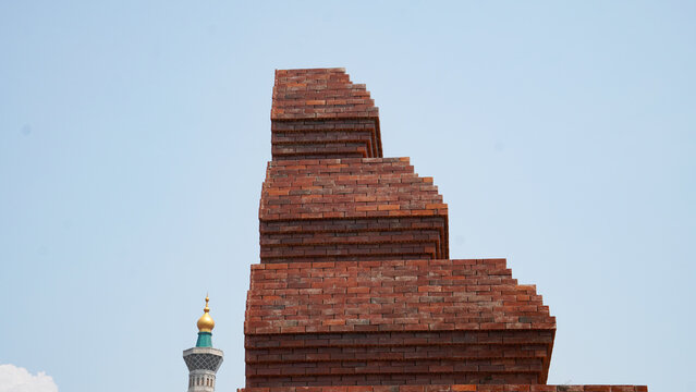 Stepped Red Brick Architectural Structure and Tower