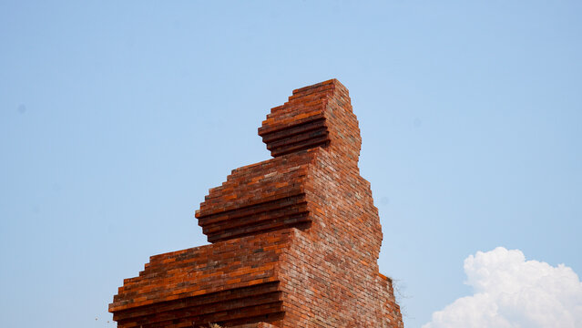 Ancient Red Brick Temple Structure Against Blue Sky