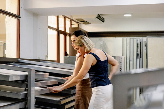 Architect and client comparing surface samples in showroom