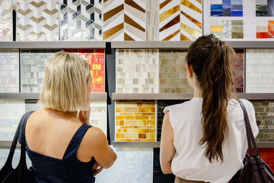 Architect and client choosing tile samples in showroom