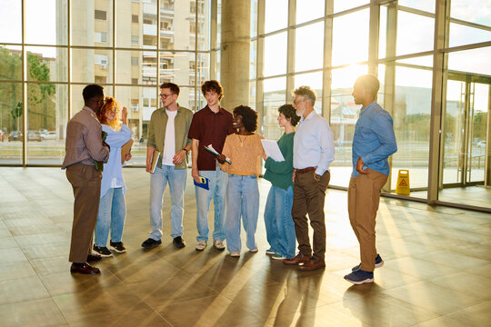 Students share their experiences in the lobby