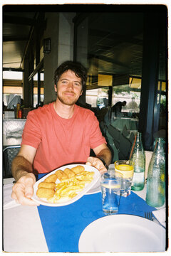 Man Enjoying a Meal in a Restaurant