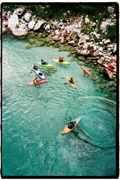 Kayakers enjoying emerald clear water of so&Auml;a river