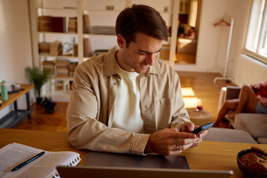Man performs multitasking at home