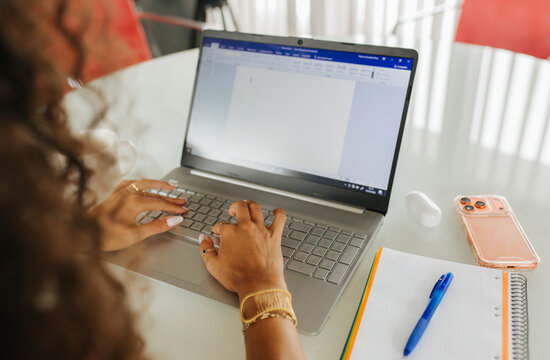 Woman Typing Document Near Phone