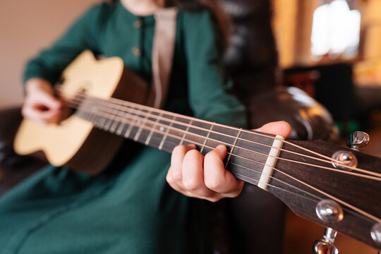 Child Playing Acoustic Guitar