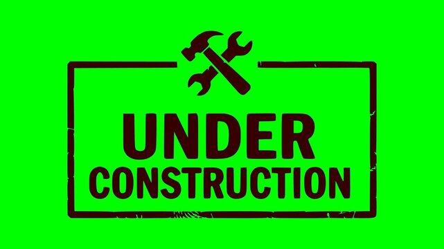 under construction black stamp animation with crossed tools and flashing red light effect over green screen chroma key background