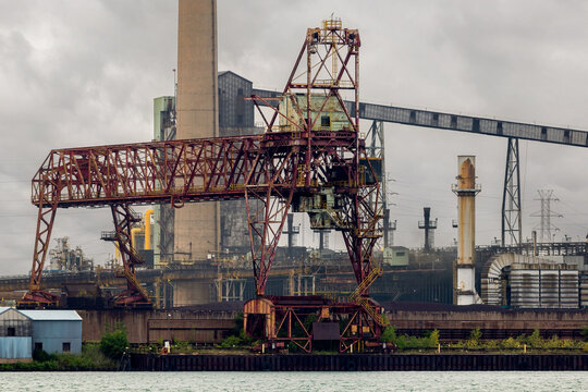 Historic Industrial Steel Mill and Ore Handling Crane on Riverfront