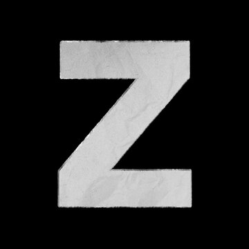 Capital letter Z cut from textured white paper isolated on a solid black background