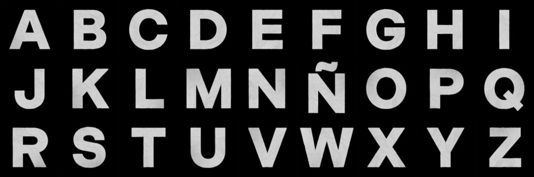 Complete alphabet letters in crumpled paper texture on black background