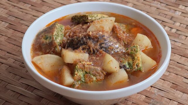 Sour curry with cha-om omelet and mixed vegetables