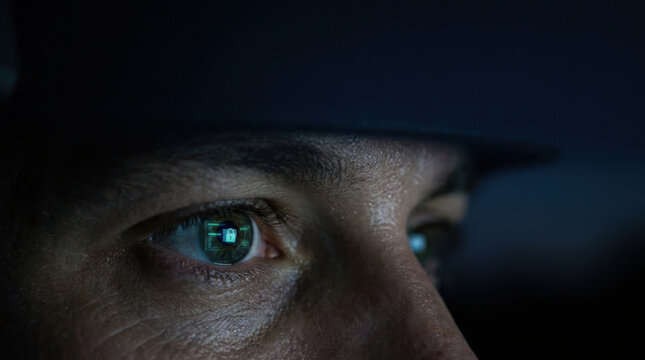 Officer eye reflection digital lock icon cybersecurity scene captures vigilant police officer under blue glow determination protecting data