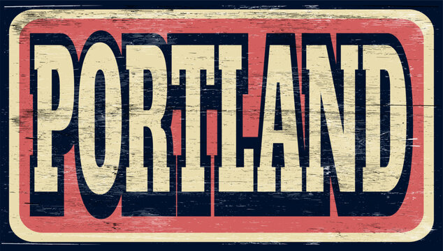 Aged and worn Portland sign on wood
