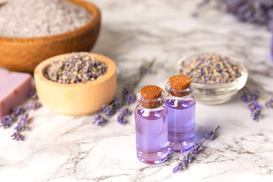 Lavender essential oil in glass and bottles with fresh lavender fowers. Natural aromatherapy. Organic skincare. Herbal cosmetic serum. Spa wellness treatment. Botanical Extract, beauty and self care 