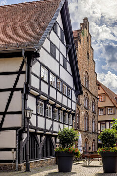 Half-timbered houses line a cobbled street in a picturesque old town: the old town of Alsfeld
