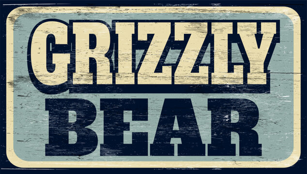 Aged retro Grizzly bear sign on wood