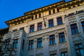 Ornate building facade against a clear blue sky © Novanture