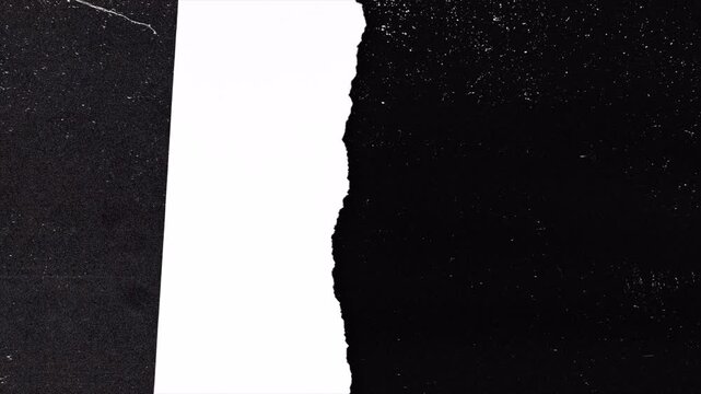 Abstract grunge overlay with torn paper effect on black background.