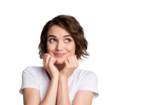 Photo of young cute girl wear casual outfit hands touch cheeks look empty space isolated over grey color background