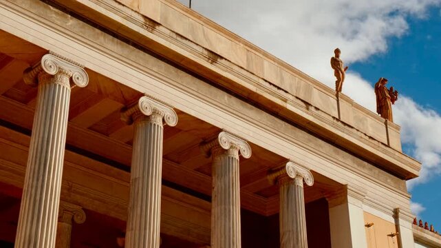 Neoclassical columns and rooftop statues at the National Archaeological Museum, Athens, Greece