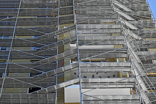 Construction site with scaffolding and thermal work