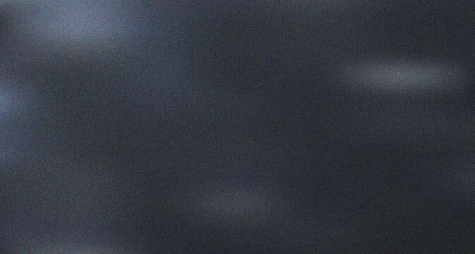Subdued dark grey textured surface featuring faint, elusive light patches creating a minimalist and sophisticated mood
