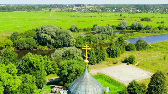 Russia, Bogolyubovo. Drone footage of Church of the Intercession on the Nerl. Orthodox church and a symbol of medieval Russia. Drone footage, Departure of the camera