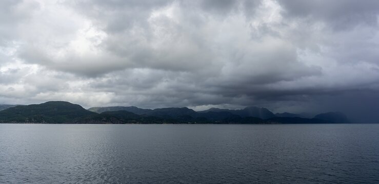 H&oslash;gsfjorden fjord landscape with stormy sky and mountains