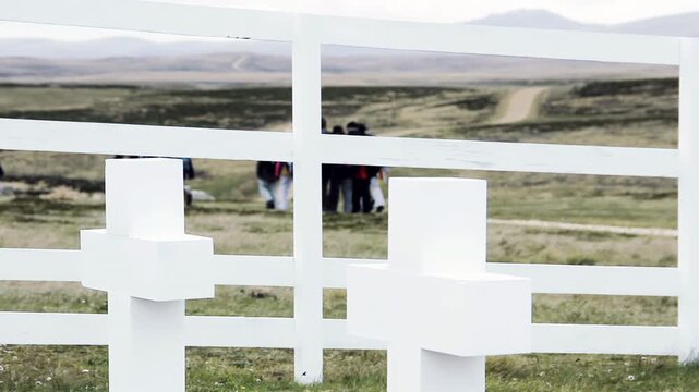 Visitors Leaving White Fence Graveyard In Slow Motion At Darwin Cemetery In Falkland Islands (Islas Malvinas) - 4K