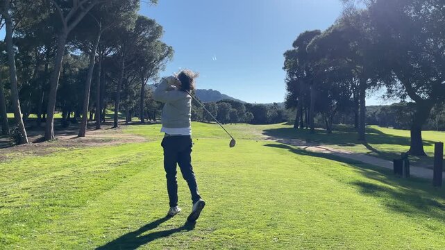 Mature Amateur Golfer Practicing His Swing on the Golf Course