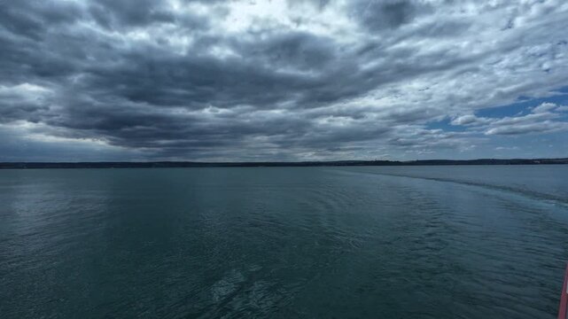 Ferry ride across Lake Constance between Konstanz and Meersburg, Germany, with views of open water, distant shoreline and surrounding landscape on an overcast day.