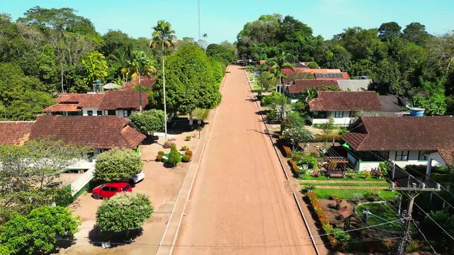 Aerial drone footage over Belterra, Par&aacute;, Brazil, a unique planned town established in the 1930s as part of an international rubber production project in the Amazon. The town preserves its distinctive