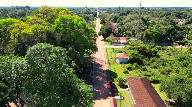 Aerial drone footage over Belterra, Par&aacute;, Brazil, a unique planned town established in the 1930s as part of an international rubber production project in the Amazon. The town preserves its distinctive