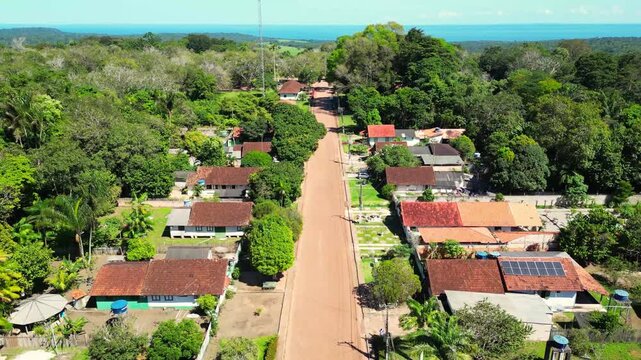 Aerial drone footage over Belterra, Par&aacute;, Brazil, a unique planned town established in the 1930s as part of an international rubber production project in the Amazon. The town preserves its distinctive