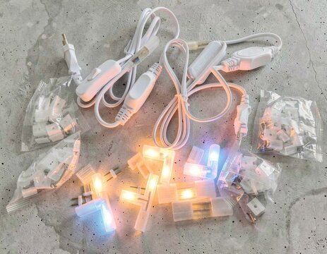 White LED strip light kit with power cords and connectors