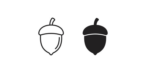 Acorn nuts set featuring both outline and solid silhouette styles for autumn nature forestry or woodland design elements. © Shan masih