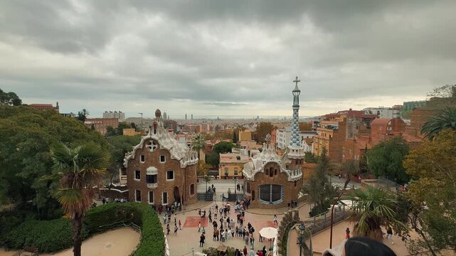 Discover the famous Park Guell in Barcelona, showcasing Antoni Gaudi's unique architecture, stone viaducts, gingerbread entrance pavilions, 