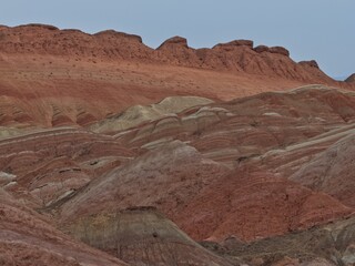 Colorful Zhangye Danxia mountains in Gansu, China, featuring layered rainbow rock formations, dramatic desert scenery and striking geology in a famous Danxia geopark. © JEREMIE
