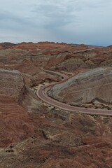 Colorful Zhangye Danxia mountains in Gansu, China, featuring layered rainbow rock formations, dramatic desert scenery and striking geology in a famous Danxia geopark. © JEREMIE