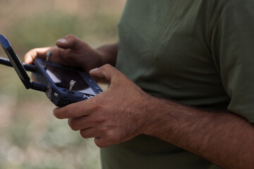 Soldier operating drone controller for surveillance mission © Dmytro