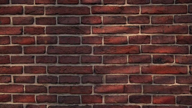 Close-up view of a red brick wall with shifting light and shadow patterns masonry texture pattern brickwork construction