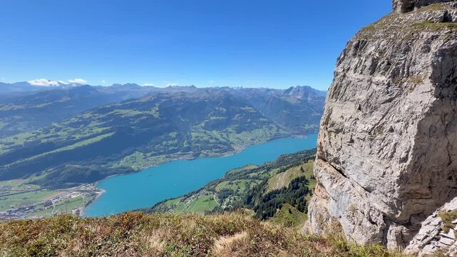 Expansive mountain view over Lake Walen from the Swiss Alps, symbolizing perspective, mental clarity, freedom, reflection and gaining distance from everyday life.