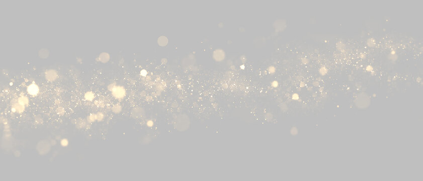 Sparkling golden glitter wave on transparent background. Shimmering dust trail overlay with glowing bokeh particles. Horizontal gold stardust light effect