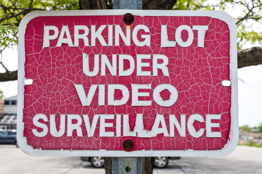 Posted Horizontal Signage Parking Lot Under Video Surveillance